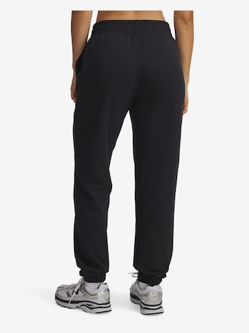 UNDER ARMOUR Tapered Sportnadrágok - fekete: hátul