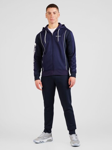 Champion Authentic Athletic Apparel Tracksuit in Blue: front