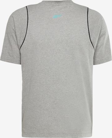 Reebok - Camiseta funcional en gris: frente