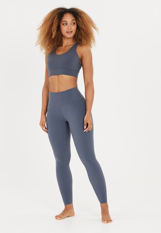 Athlecia Skinny Sportbroek 'Stay' in Blauw