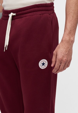 Tapered Pantaloni 'CHUCK' di CONVERSE in rosso