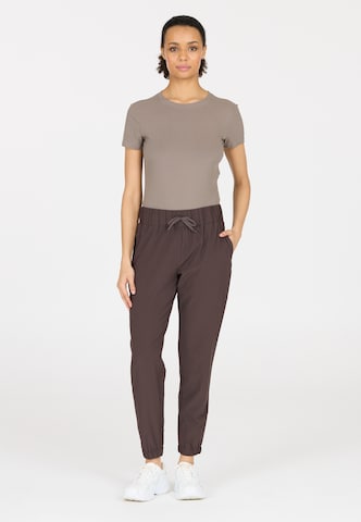 Athlecia Tapered Sports trousers 'Austberg' in Brown