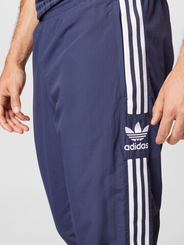 adidas Originals Adicolor Classics Firebird Track Pants em Azul Escuro