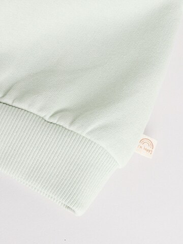 Next Juoksupuku värissä vihreä