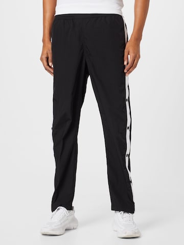 Loosefit Pantalon Tommy Jeans en noir : devant