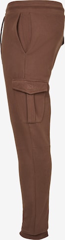Tapered Pantaloni cargo di Urban Classics in marrone