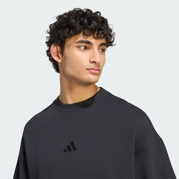 ADIDAS SPORTSWEAR - Camiseta deportiva en negro