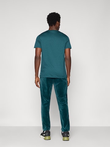 PUMA Regular Broek 'ESS' in Groen