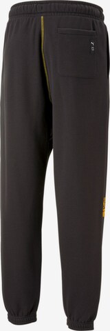 PUMA - Tapered Pantalón deportivo en negro