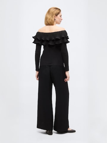 Top ' Flouncecras ' di Crās in nero: dietro
