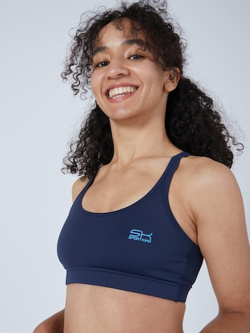 SPORTKIND Sport bh 'Crossed Straps' in Blauw: voorkant