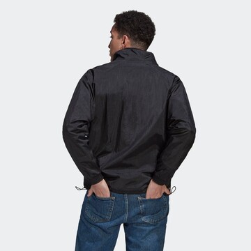 ADIDAS ORIGINALS Übergangsjacke 'Reveal Material Mix' in Schwarz