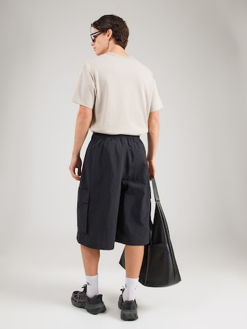 Nike Sportswear Loosefit Cargobyxa 'CLUB' i svart