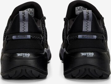 PUMA Bootsit 'Explore Nitro' värissä musta