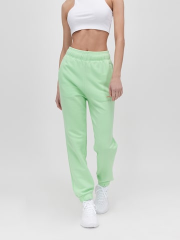 UNFOLLOWED x ABOUT YOU Tapered Pants 'HUNGRY' in Green: front