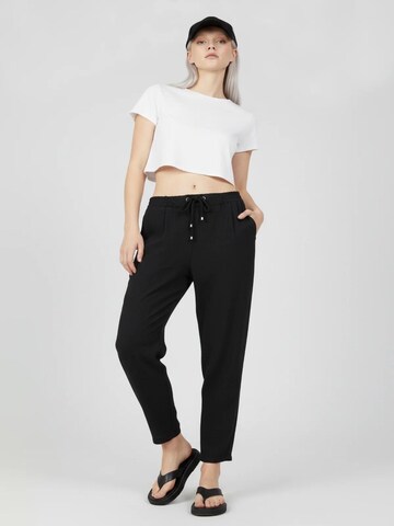 No Matter What Tapered Pleat-front trousers in Black: front