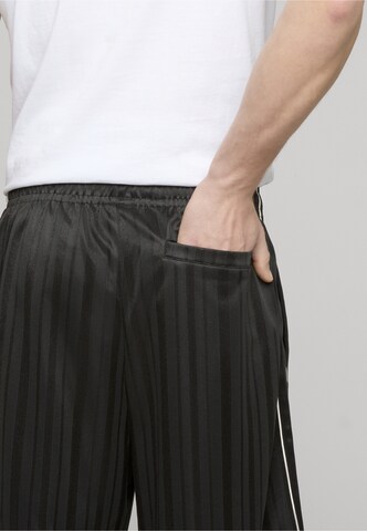 Loosefit Pantaloni di Karl Kani in nero