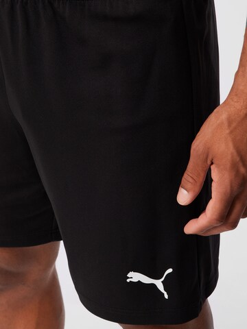 Regular Pantalon de sport 'TeamRise' PUMA en noir