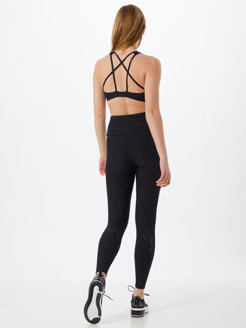 Skinny Pantaloni sportivi 'Selenite' di Onzie in nero