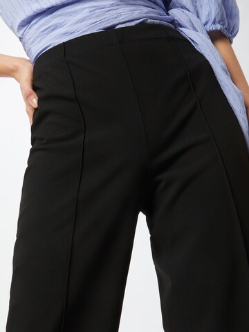 MADS NORGAARD COPENHAGEN Flared Trousers in Black