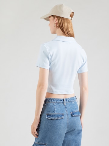 T-shirt 'ESSNTL' Nike Sportswear en bleu : derrière