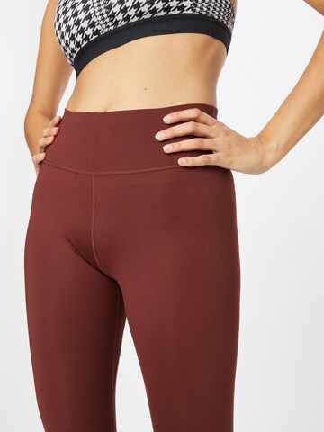 NIKE Skinny Sportbroek 'One Luxe' in Bruin