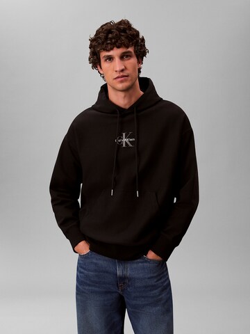 Sweat-shirt 'Premium' Calvin Klein Jeans en noir : devant