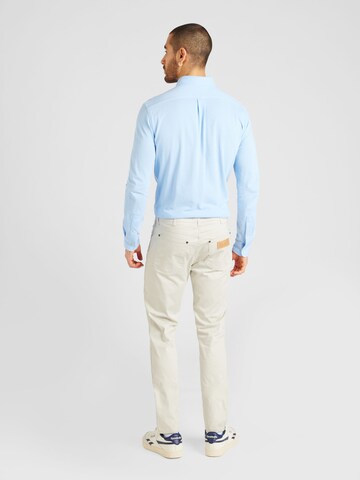 Coupe slim Jean 'LARSTON' WRANGLER en blanc