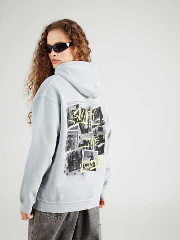 BDG Urban Outfitters Sweatshirt 'SMASH THE SYSTEM' in Blauw: voorkant