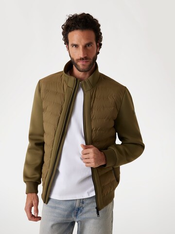 GUESS Between-Season Jacket in Green: front