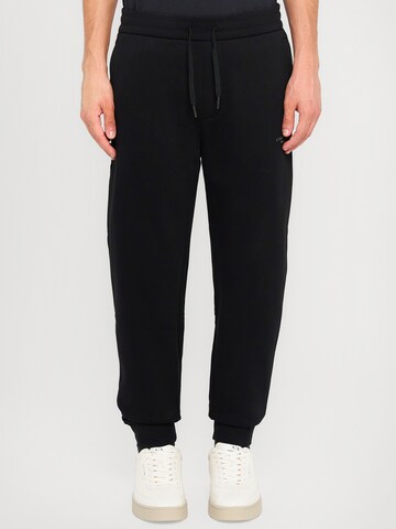 ARMANI EXCHANGE Tapered Trousers in Black: front