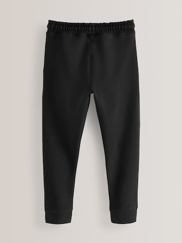 Skinny Pantaloni di Next in nero