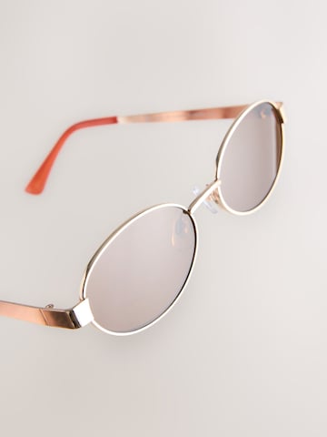 Lunettes de soleil Next en or