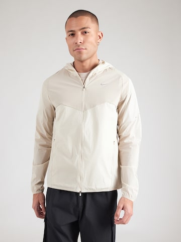 NIKE Træningsjakke 'NK' i beige: forside