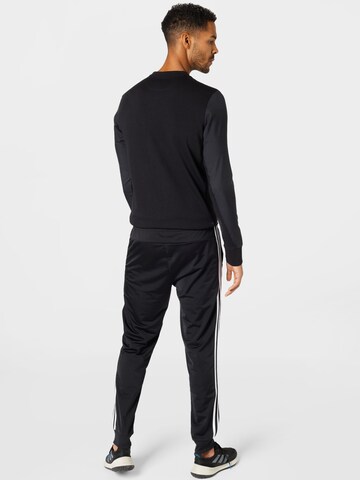 ADIDAS SPORTSWEAR Дънки Tapered Leg Спортен панталон 'Essentials' в черно