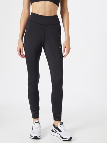 PUMA Skinny Workout Pants in Black: front