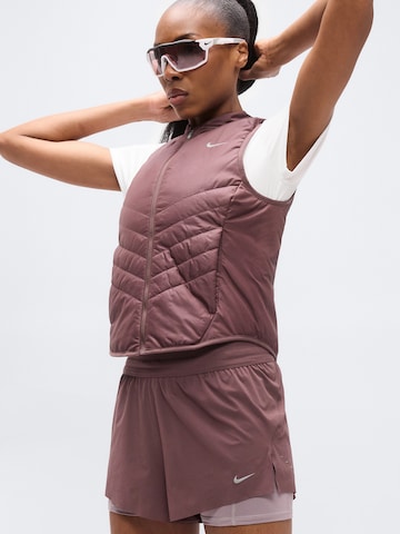 Loosefit Pantalon de sport 'SWIFT' NIKE en rouge