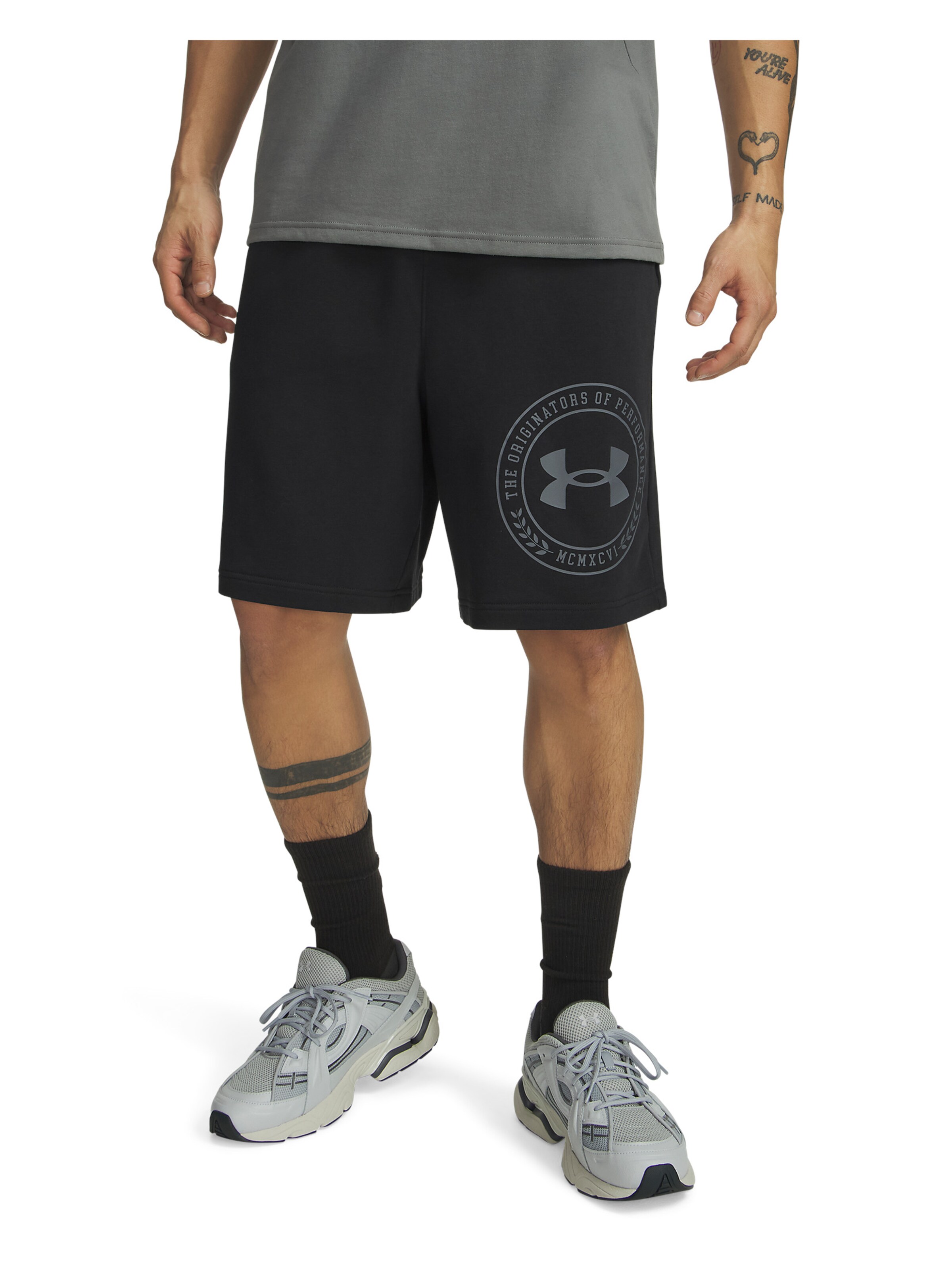 UNDER ARMOUR Wide leg Sportbroek 'Rival' in Zwart: voorkant