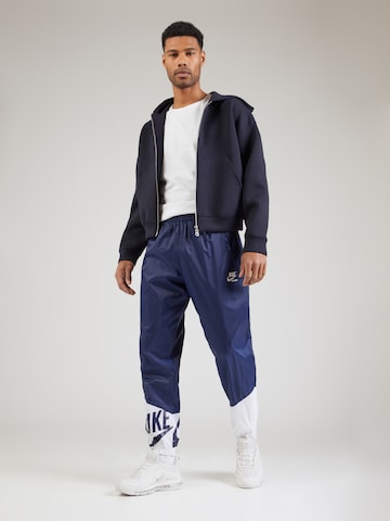 Nike Sportswear Tapered Trousers in Blue