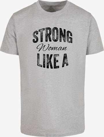 Merchcode Shirt 'Strong Like A Woman' in Grau: predná strana