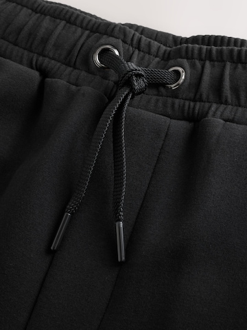 Tapered Pantaloni di Next in nero