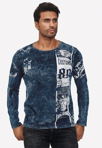 Rusty Neal Langarmshirt mit plakativem Front & Back Print in Blau: predná strana