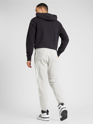 ADIDAS SPORTSWEAR Tapered Sports trousers 'Future Icons' in Grey