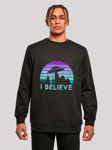 Sweat-shirt 'I BELIEVE UFO Alien Raumschiff Retro' F4NT4STIC en noir : devant