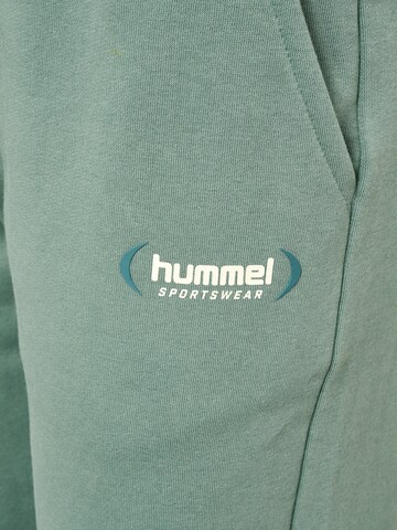 Effilé Pantalon de sport Hummel en vert