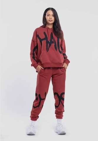 Tom Barron Sports Suit 'Chaos' in Red