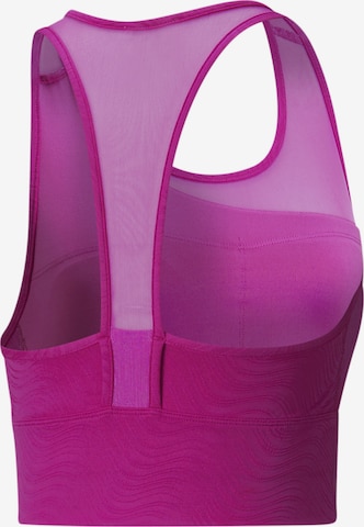 Bustino Reggiseno sportivo di PUMA in rosa