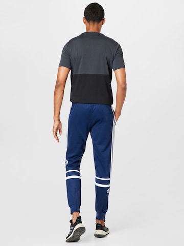 ADIDAS ORIGINALS Tapered Housut 'Adicolor Classics Cutline' värissä sininen