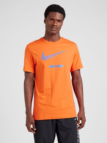Nike Sportswear - Camiseta 'SWOOSH' en naranja: frente