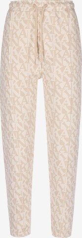 Effilé Pantalon Karl Kani en beige : devant